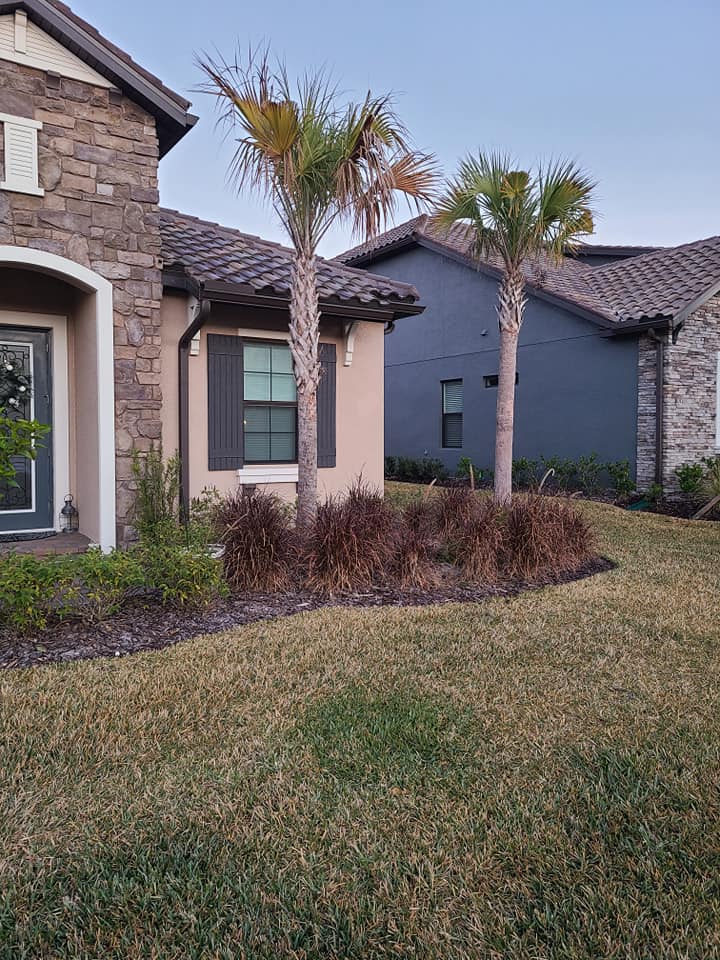 Paver patio with garden border plantings, residential property in Land O' Lakes, FL